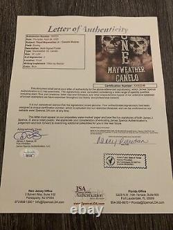 Floyd Mayweather Jr Saul Canelo Alvarez Dual Signed Richard Slone Poster #1 JSA   <br/>
 <br/>Affiche signée en double par Floyd Mayweather Jr et Saul Canelo Alvarez, par Richard Slone, numéro 1 JSA